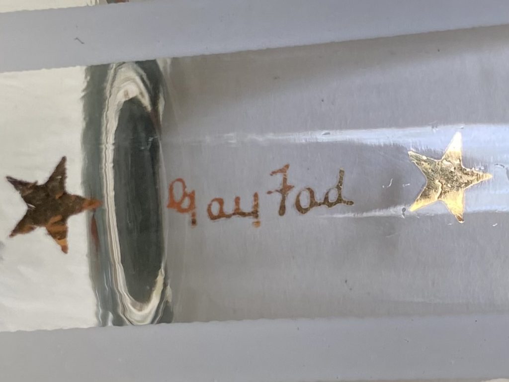 Gay Fad signature on a shot glass written in gold.